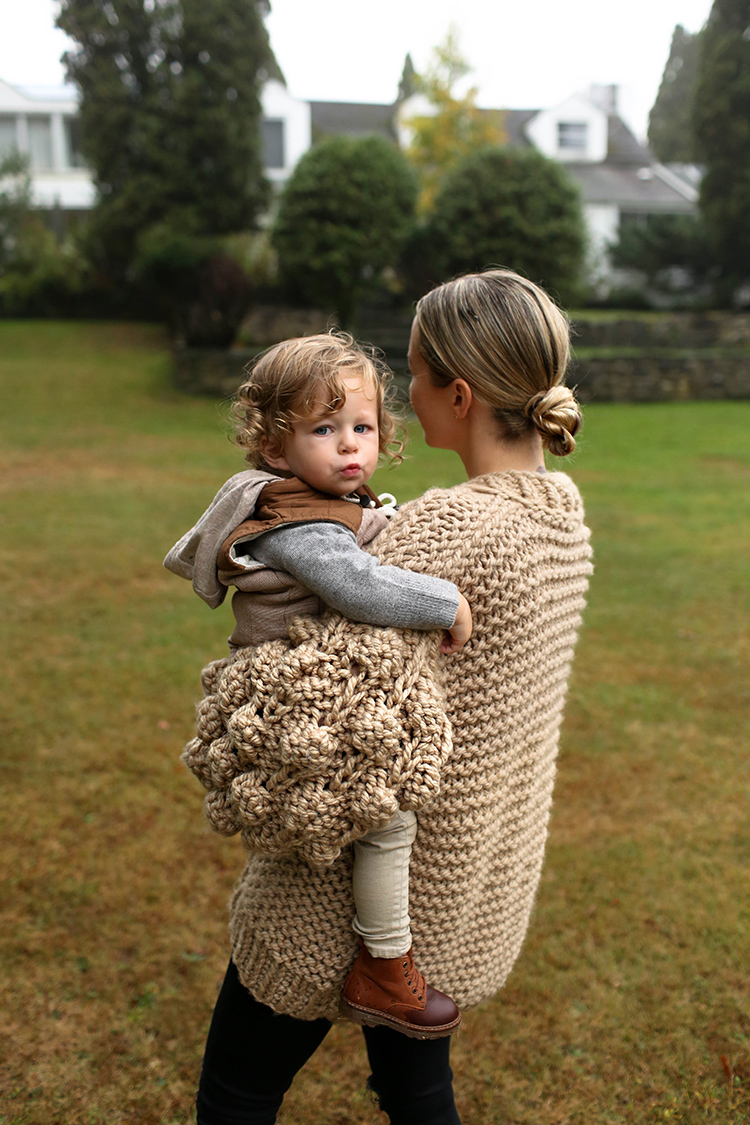 mother carrying her child