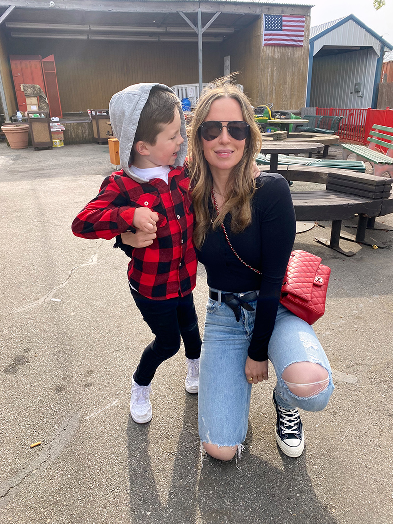woman with a little boy in a park 